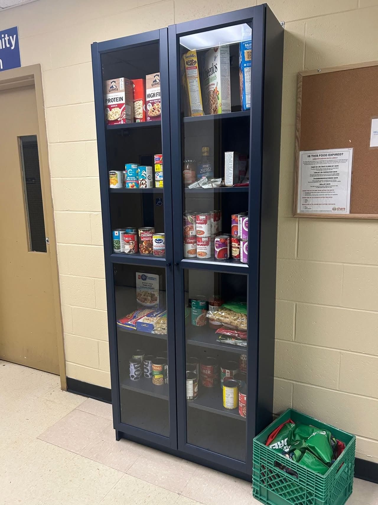 Shelves of the Westville Community Pantry, stocked with donated food for neighbours in need